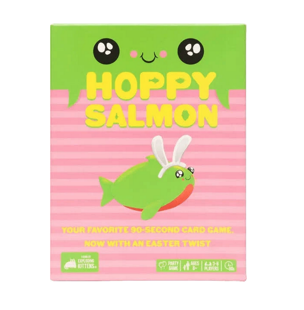 Box containing the game Hoppy Salmon. The box is bright green at the top leading to pink stripes. There are wide eyes at the top of the box and in the center an illustration of a chunky fish wearing bunny ears. 