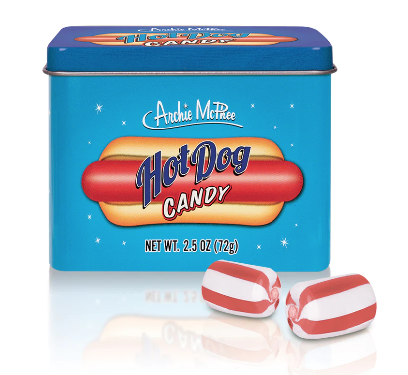 Red and white striped hot dog flavored hard candy in front of the tin it comes packaged in. 