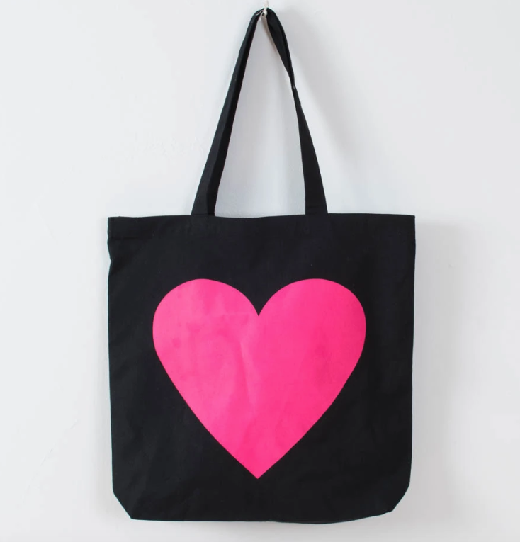 Black tote back with a big pink heart.