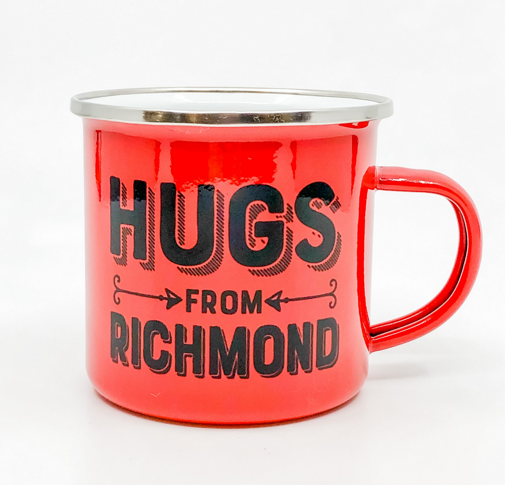 Red stainless steel camp mug that reads "Hugs from Richmond" in black text.