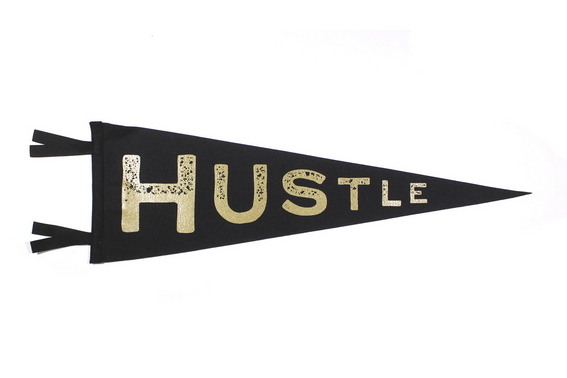 Black pennant says "Hustle" in gold.