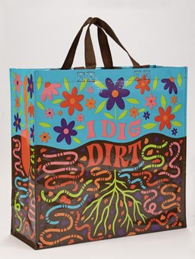 Two handled shopper, the top half is turquoise blue with pink, purple, and red flowers and below underground with bright green, blue, pink, tan, and brown earthworms. The words "I Dig Dirt" in pink letters. 