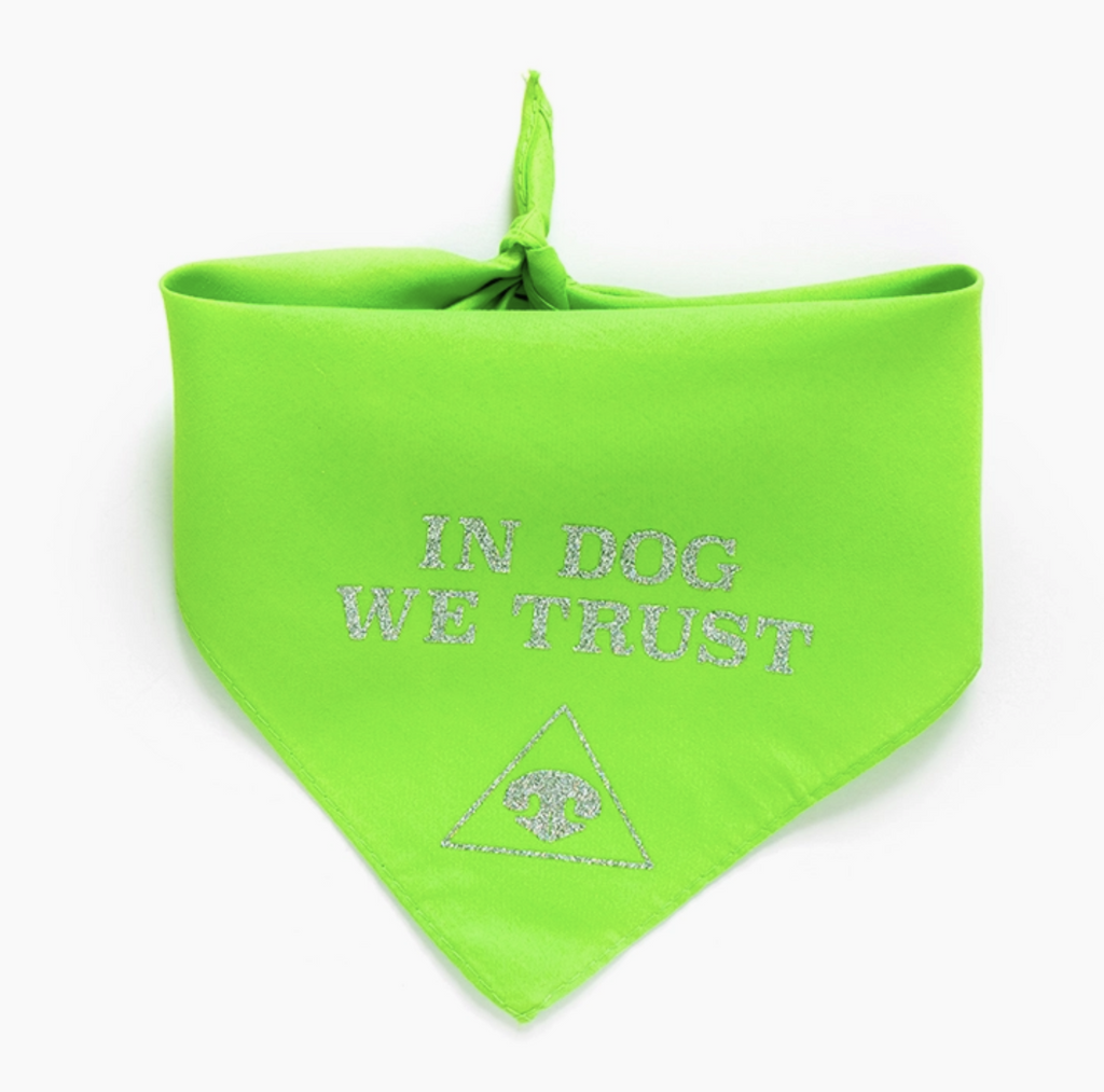 Neon green bandana for dogs. Reads In Dog We Trust in silver glitter above a triangle with a dog nose print inside.