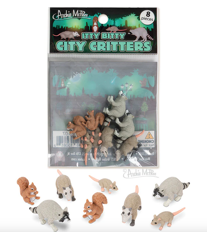 Itty Bitty City Critters including raccoon, rat, possum and squirrel. Shown here in a clear plastic bag, and also standing in front of the bag. 