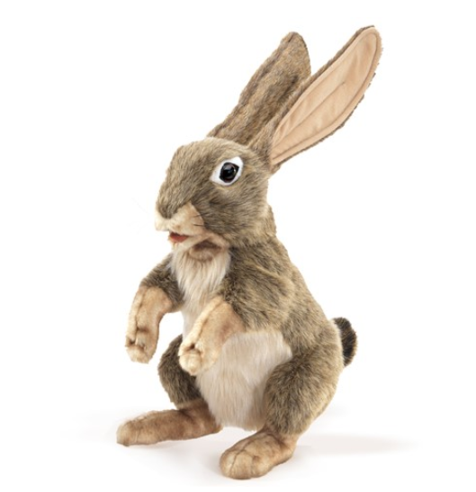 The Jack Rabbit puppet sitting up on it's hind legs and it's long ears perked up. 