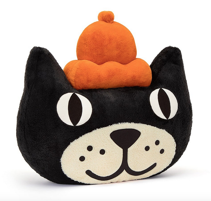 Gigantic plush Jellycat Jack head. With his black face and white mouth and nose and his orange hat. 