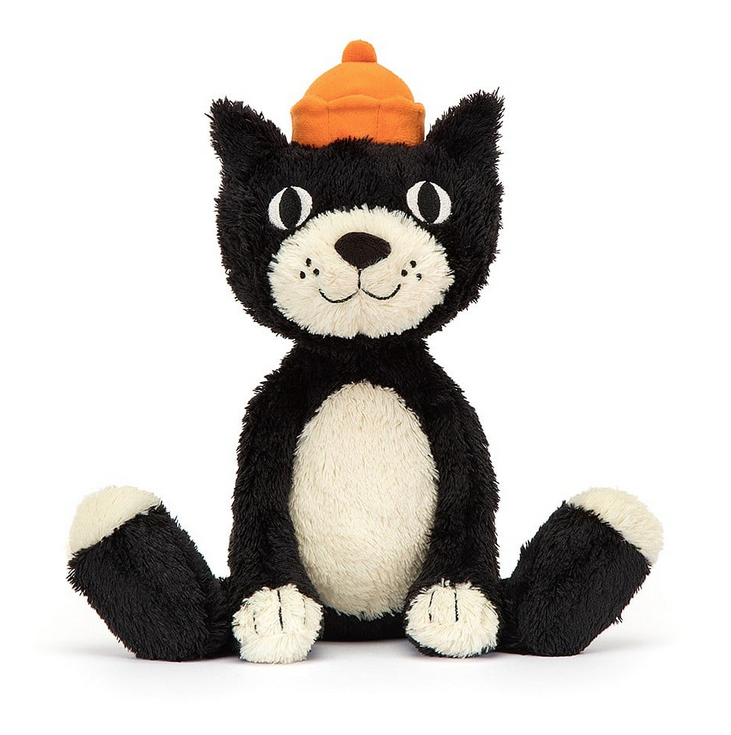 Jellycat Jack tuxedo cat with white belly and black body. He's sitting up facing forward and wearing an orange hat. 