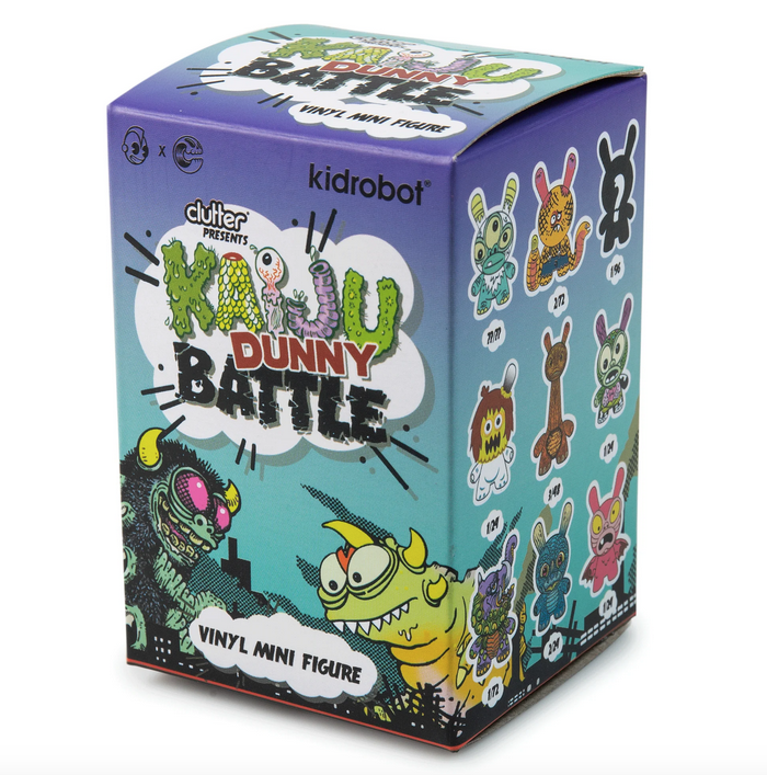 Kaiju Dunny Battle Mini Fugure box. The front of the box has illustrations of two monsters battling and you can see the side of the box which has illustrations of all the figures. 