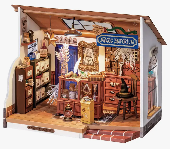 Diy miniature house kit: Kiki's Magic Emporium with led lights by Hands Craft. Perfect for birthdays, a crafting hobby project, and makes great home or office decor. Includes glue, tweezer, wiring, led light, battery box, and all parts required to build. Requires 2 AAA batteries (not included). 