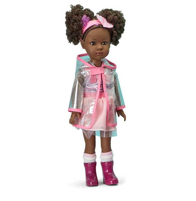 Madame Alexander Zola Kindness Club Doll has brown curly hair in two piig tails with a headband with a purple strip near her face. She has a dark skin tone and brown eyes. Her outfit is a pink and purple mini dress, a a clear rain coat,  pink socks and purple boots..