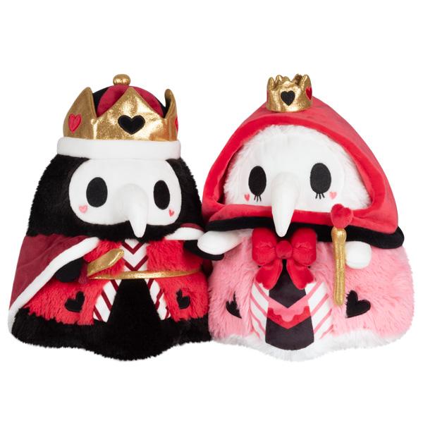 The King and Queen of Hearts plush figures holding hands in red and pink valentines robes and crowns. 