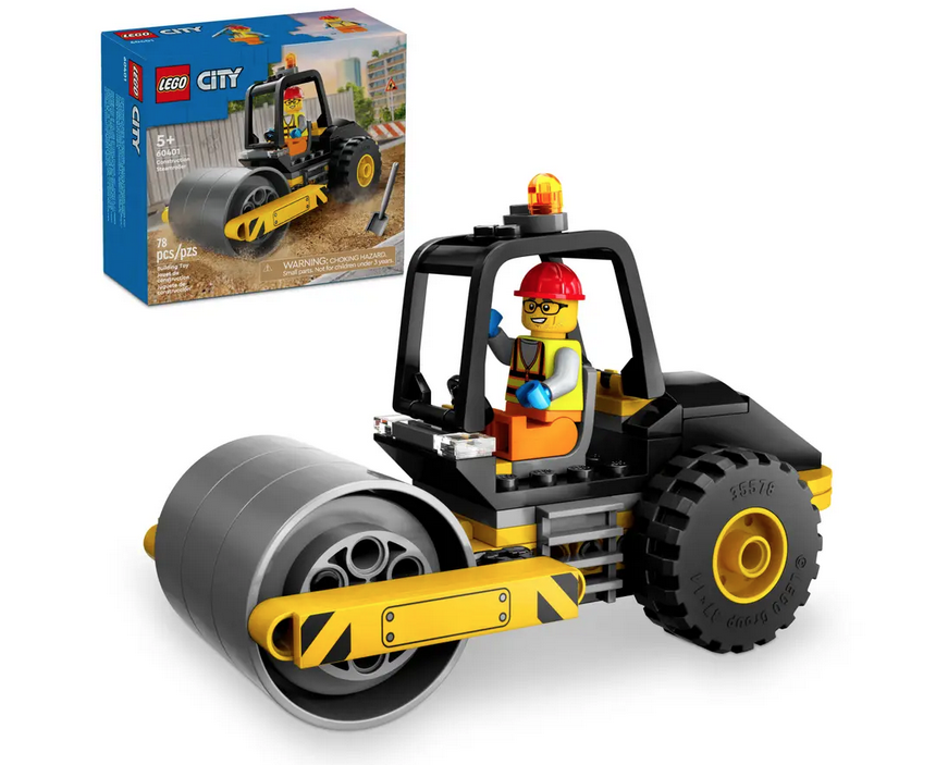 The completed build of the LEGO City Steamroller construction toy with the minifigure driver in the cab. The LEGO box is in the background. 