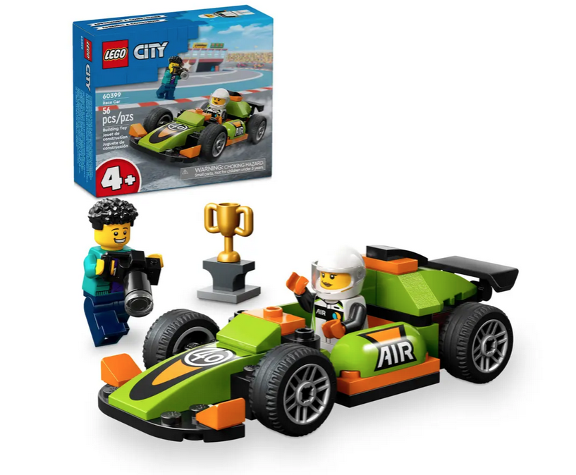 The LEGO Green Race Car assembled with the driver mini figure, photographer minifigure and trophy, with the box in the background. 
