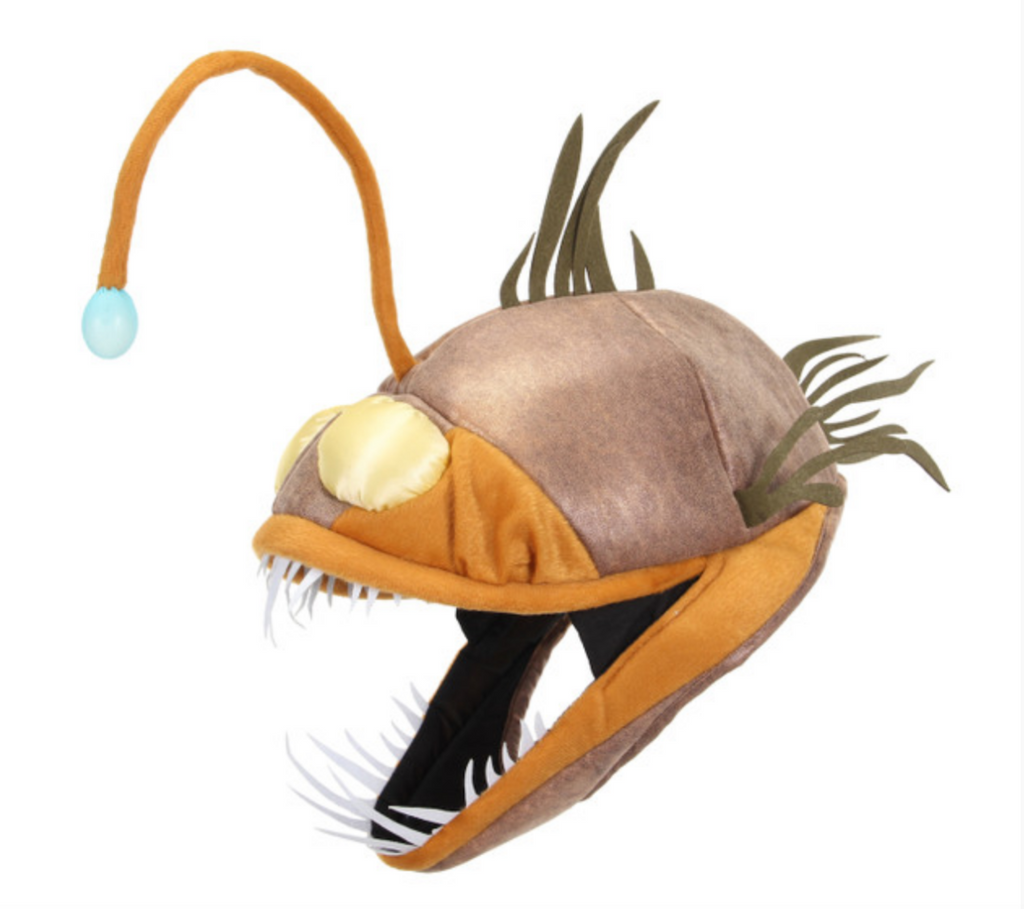 Light-up Anglerfish Jawesome Hat! Featuring a faux suede outer shell, with felt teeth and fins that give it a realistic and menacing angler fish look. Also has a light-up bendable lure 