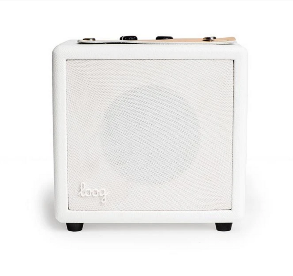 White mini amp for Loog electric learning guitars.