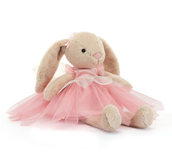Sweet tan Lottie Bunny Fairy is dressed in a pink satin dress with pink and white tuille as well as a pink satin ribbon by her ear. 
