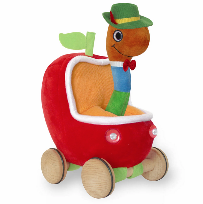 Lowly Worm is dressed in his rich blue and green outfit, red sneaker, bow tie, and green alpine hat with yellow grosgrain trim. Lowly Worm fits snuggly inside his apple-shaped car, made of soft red plush with orange tricot interior.