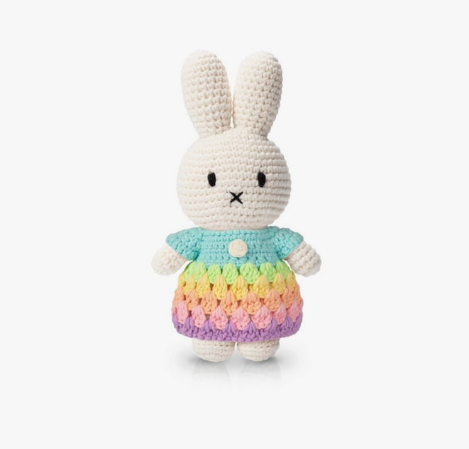 Miffy crocheted doll wearing a pastel pink dress.