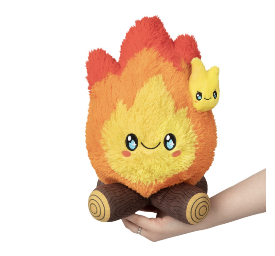 Hand holding Mini Campfire Squishable plush.
