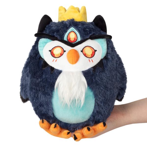 Small plush Demon Owl Squishable, is a beautiful midnight blue with a powder blue belly and wispy white beard. All of his eyes are the color of fire even his third eye. A yellow crown completes this demon owls loveable look. 