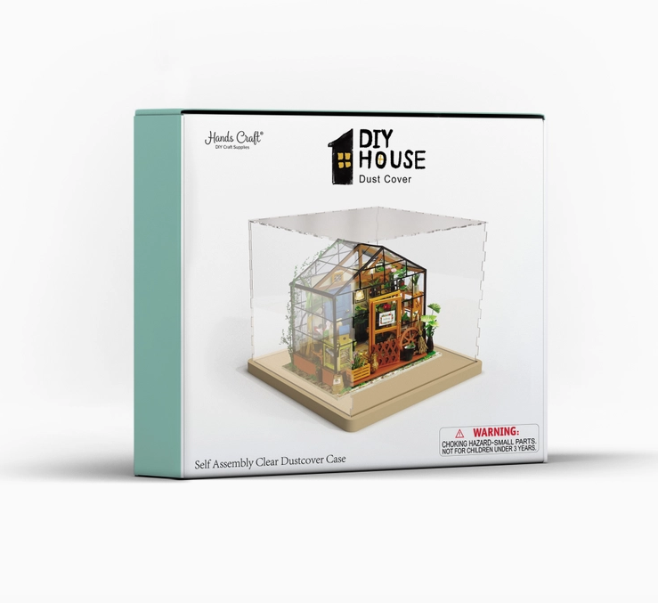 White box with picture of the clear acrylic dust cover over a completed greenhouse model. 