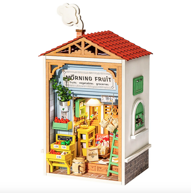 The Morning Fruit Store Mini House Kit built and displaying the fruit bins, ladders and working lights that are part of the model. 