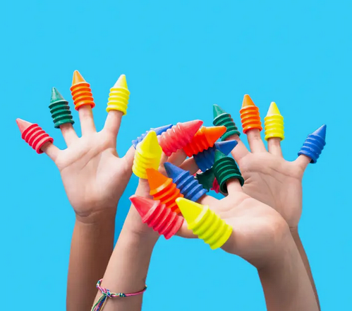 Four sets of childrens hands with the finger crayons on each finger. The blue background highlights the bright colors of the crayons. 