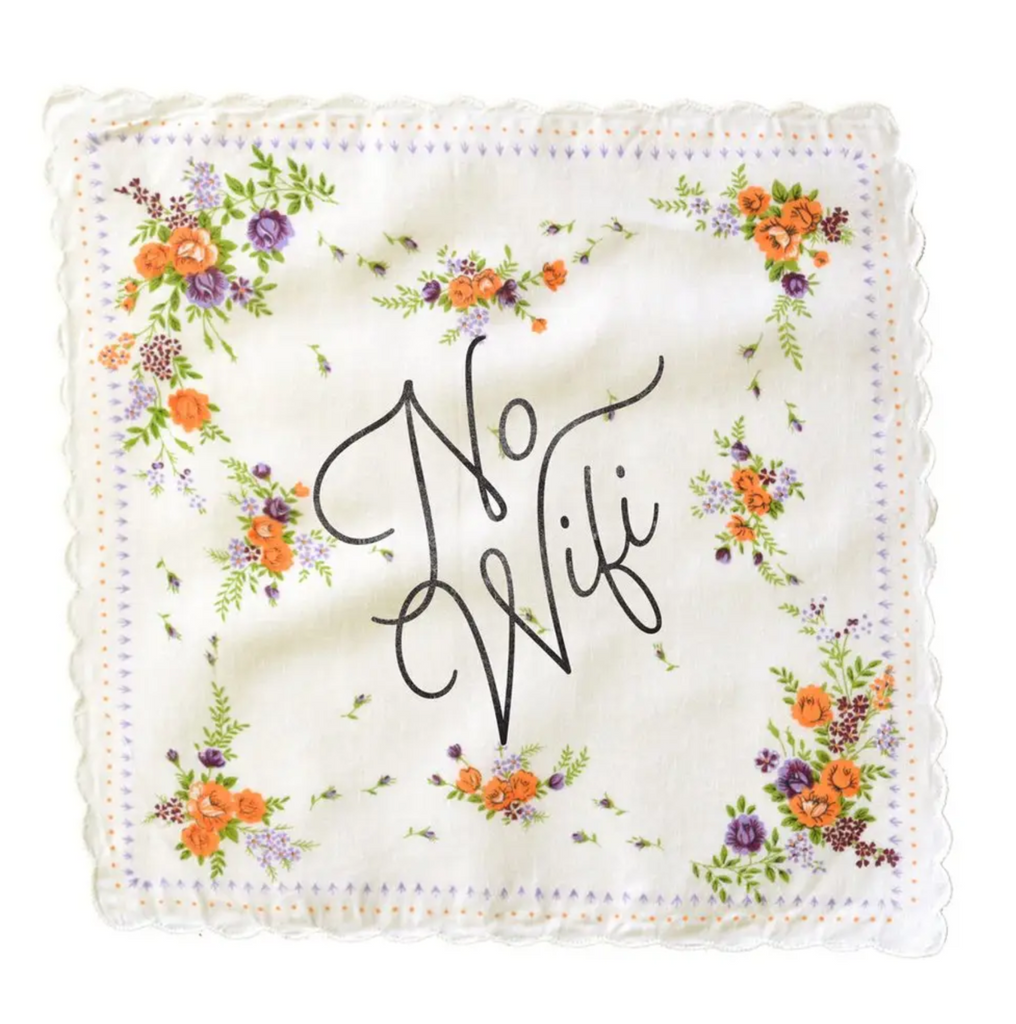 White hankerchief with a floral pattern. Text says No Wi-Fi in black cursive.