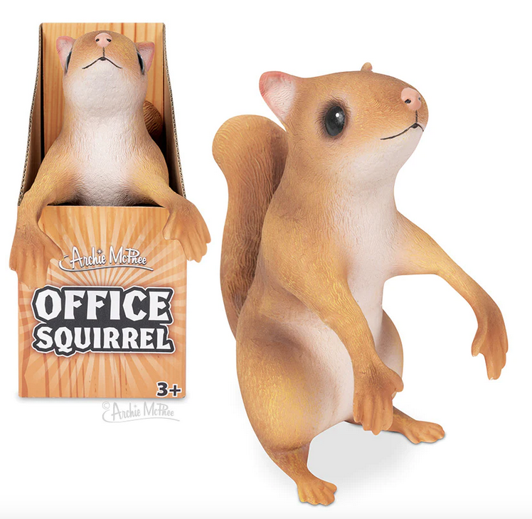 The Office Squirrel is an 8-1/2" tall, stuffed latex squirrel with bendable, posable arms. One out of the box and one in the background in a box. 