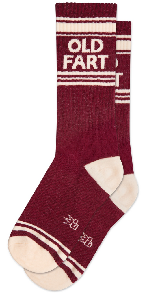 Burgundy socks with off white stripes the read "Old Fart" unisex, one size fits most. Cotton-polyester-spandex-rubber blend. Wide ribbed socks reach to mid-calf on most folks.
