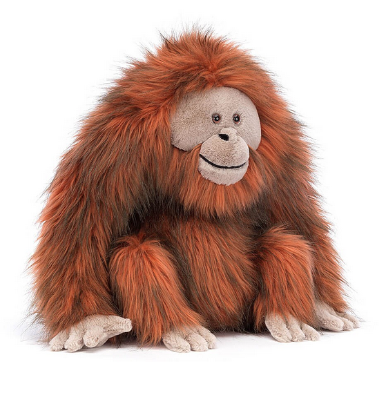 Oswald Orangutan has shaggy fur in chocolate-orange fur, with truffle colored face, hands and feet.
