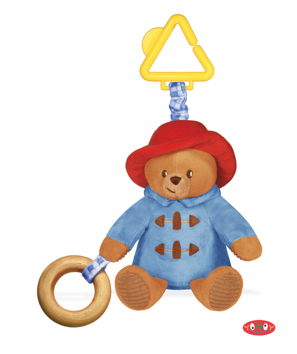 Paddington Stroller Toy is delightfully engaging for babies as they learn through active play. The delightfully cozy gingham print pattern invites babies to focus, while the elastic feature adds bounce and movement, further enhanced by Paddington’s flexible mirror on his bottom. A wooden teether ring, soft velour hat and coat, and sweetly embroidered nose.