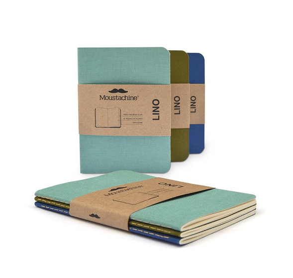 The Passport Notebook set in teal blue, olive and bright blue. 