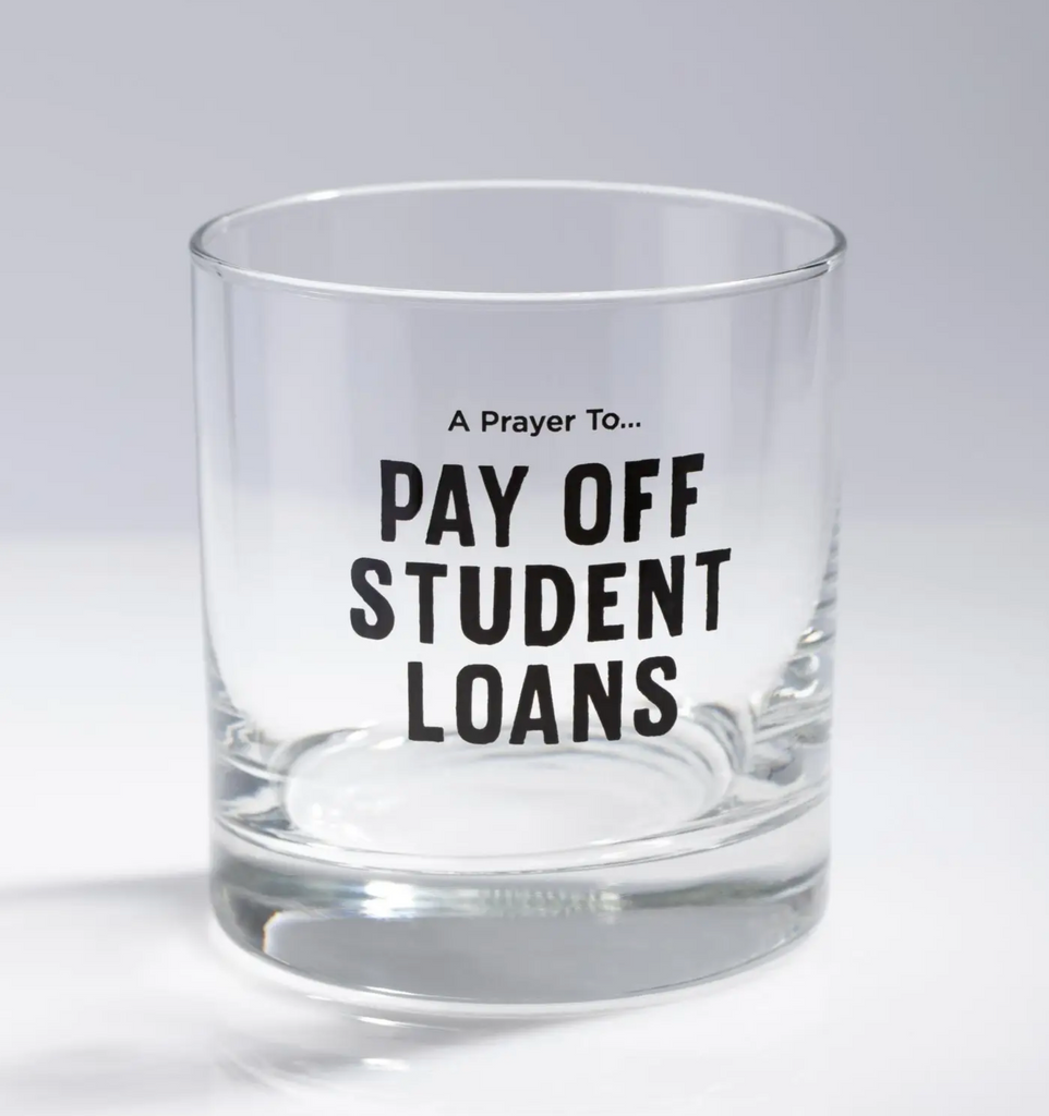 A prayer to pay off student loans candle empty and used as a cup.
