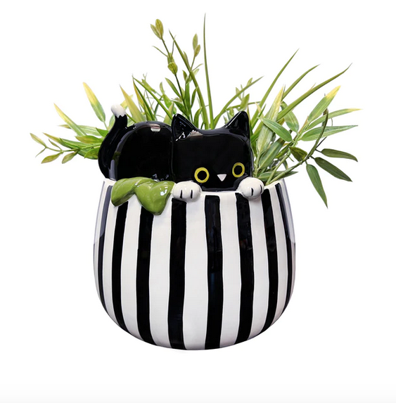 The Peek a Boo Kitty ceramic planter, the bowl of the planter is black and white striped with a black kitty peeking put of the top . 