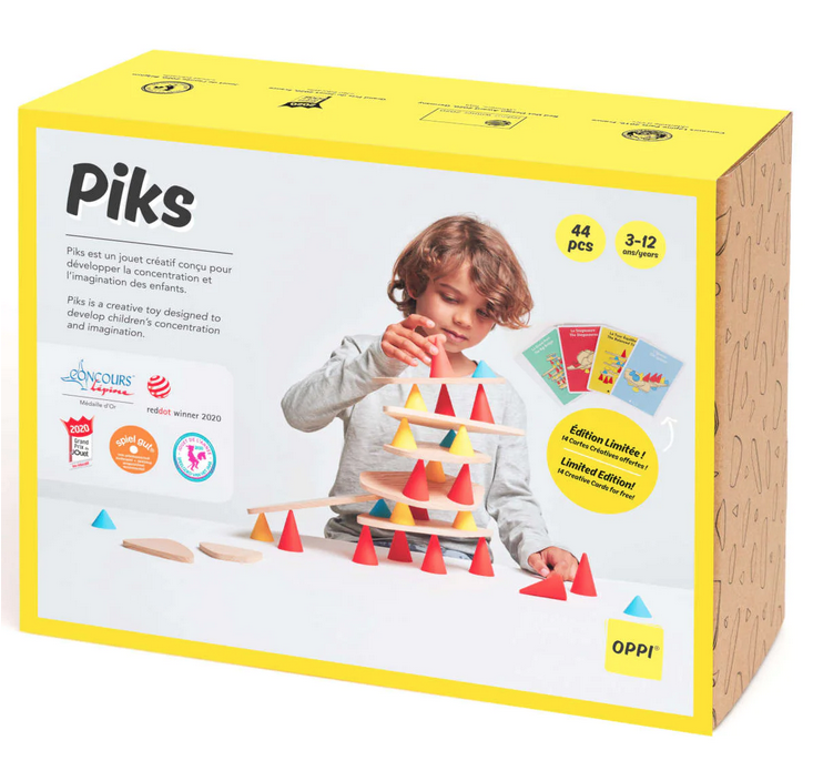 The box that the Piks 44 Piece Medium Kit comes in. It features a child using red, yellow, and blue cones with wooden planks to construct a multileveled platform. 