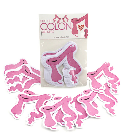 Package of large pink colon shaped stickers with individual stickers scattered around. 