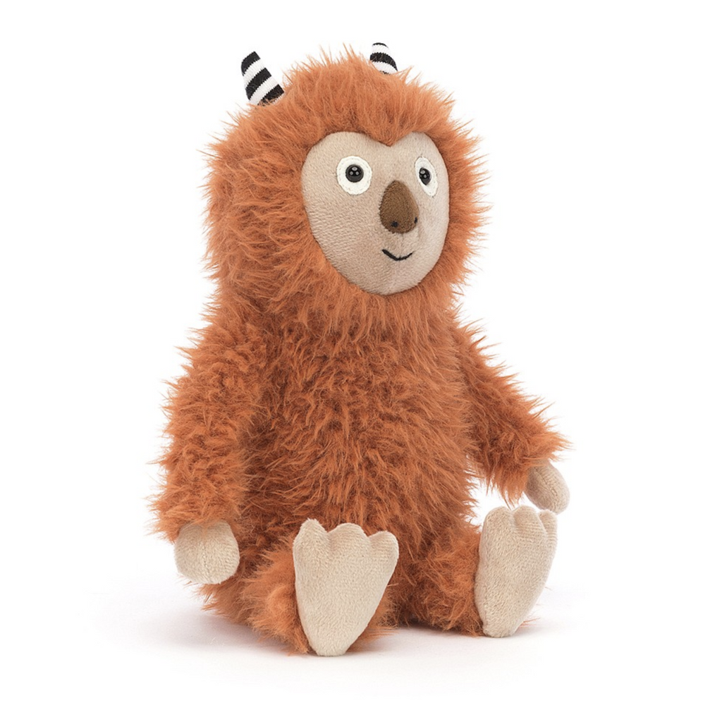 Brown shaggy monster with black and white striped horns plush by Jellycat.