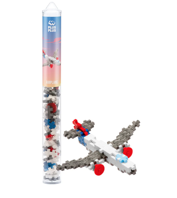 A reusable, travel-friendly tube with instructions to build an Airplane. The Plus Plus 70 piece tube includes the colors red, blue, pastel blue, white, and silver. An assembled airplane is shown beside the tube using the Plus Plus pieces. 