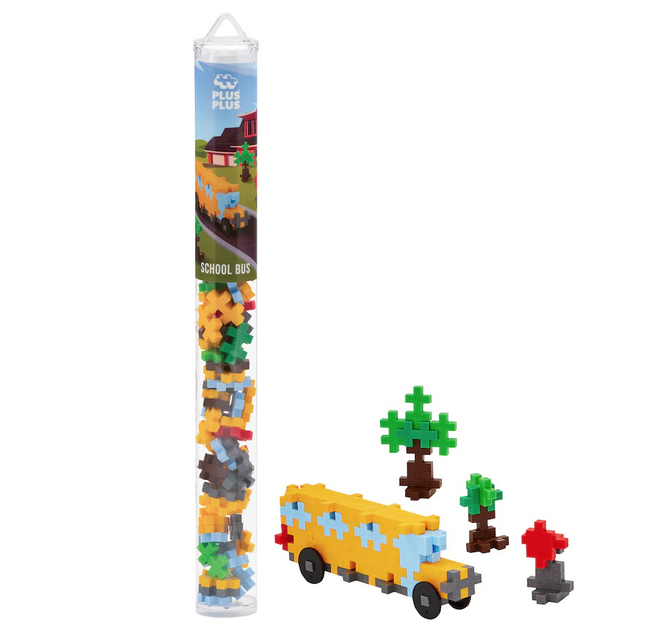 The 70 piece School Bus tube holds the one piece with endless possibilities that Plus Plus is famous for.  A reusable, travel-friendly tube with an instructions flyer and 70 pieces in the colors red, green, apple, smoke, brown, mustard, and pastel blue. Also shown is a completed school bus, trees and a stop sign. 