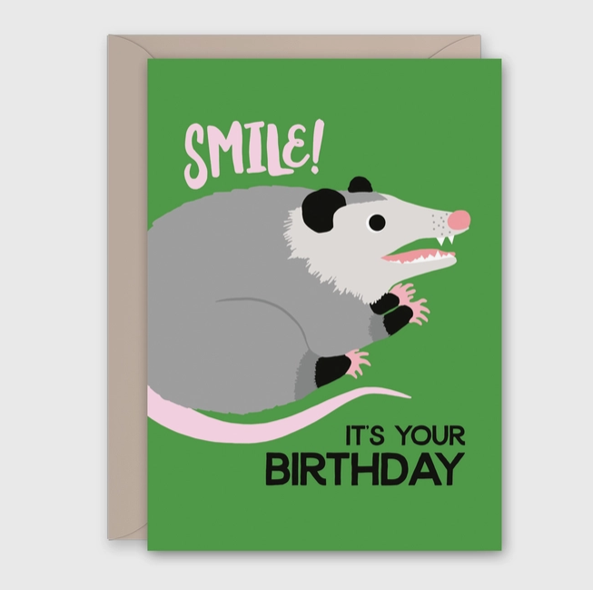 Front of card with a possum on green background that reads " Smile! It's Your Birthday" 