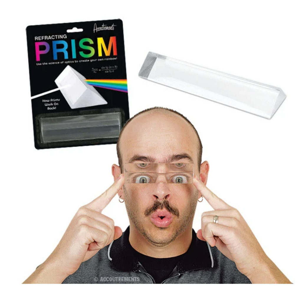 Image of a male holding a clear prism horizontally over his eyes, which can be seen reflecting into several pairs as seen through the prism.