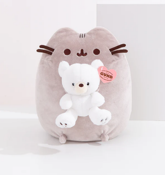 Pusheen in her signature grey color holding a sweet little teddy bear with white fur. 
