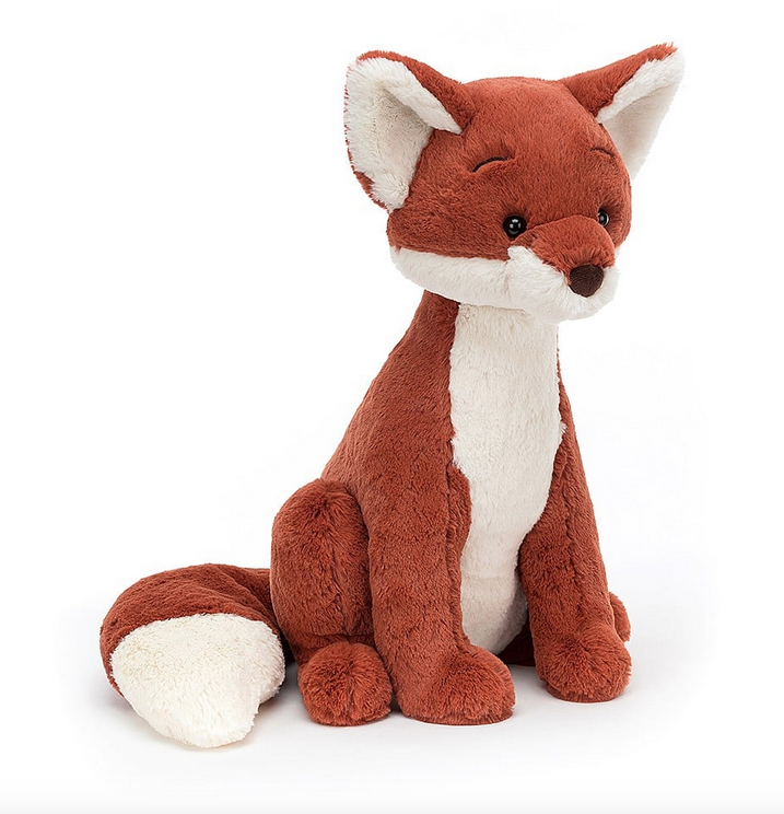 Quin Fox plush sitting upright and facing forward with it's bushy tail wrapped around  it's legs. 
