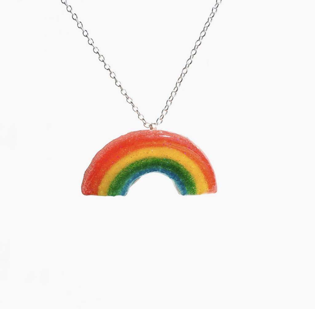 Rainbow gummy candy dipped in resin on a silver chain necklace.