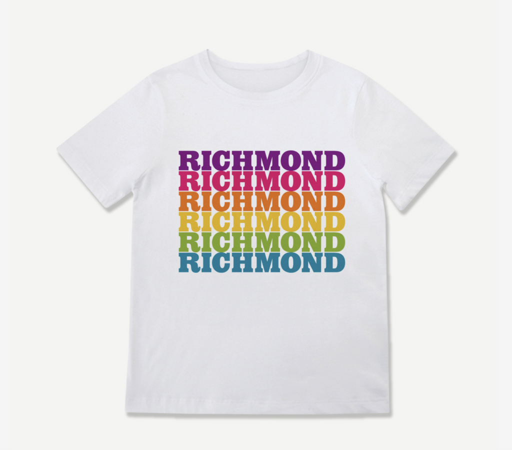 White toddler tee that says Richmond in repeating rainbow colors.