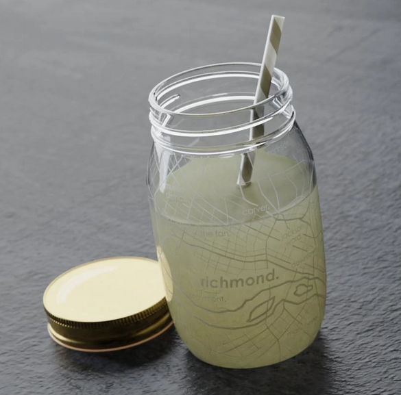 Clear Mason jar with an etched map of RVA in white. The jar is holding lemonade to show off the map and the included cap is resting beside the jar. 