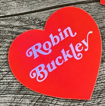 Red heart sticker reads Robin Buckley in white.