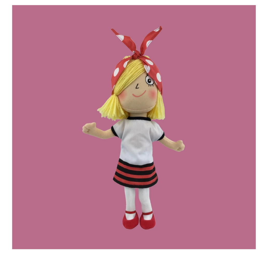 Plush doll of Rosie Revere, Engineer wearing a white dress with black and red stripes on the bottom, white leggings, red shoes, and a red and white polkdot hair tie in her blond hair.