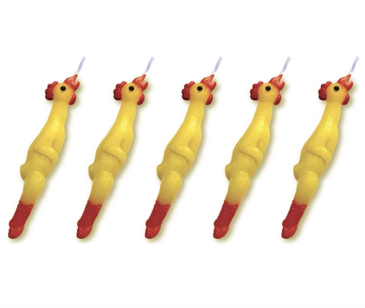Close up view of the five rubber chicken candles. Each has a bright yellow body with red comb and wattle, as well as red feet. 